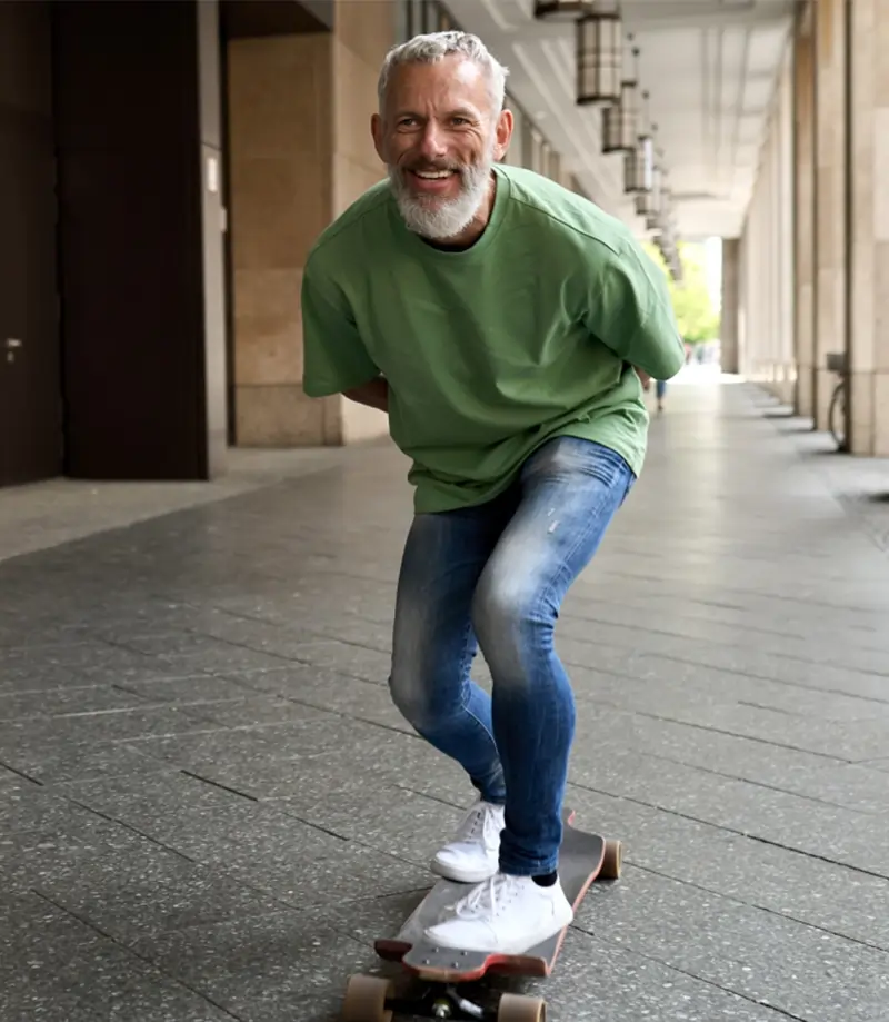 Active older man skating in Los Angeles, staying strong with radiation free bone scanning services